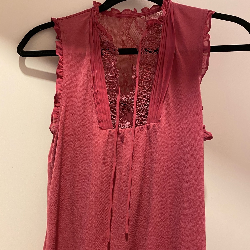 Maybe pink tank blouse top